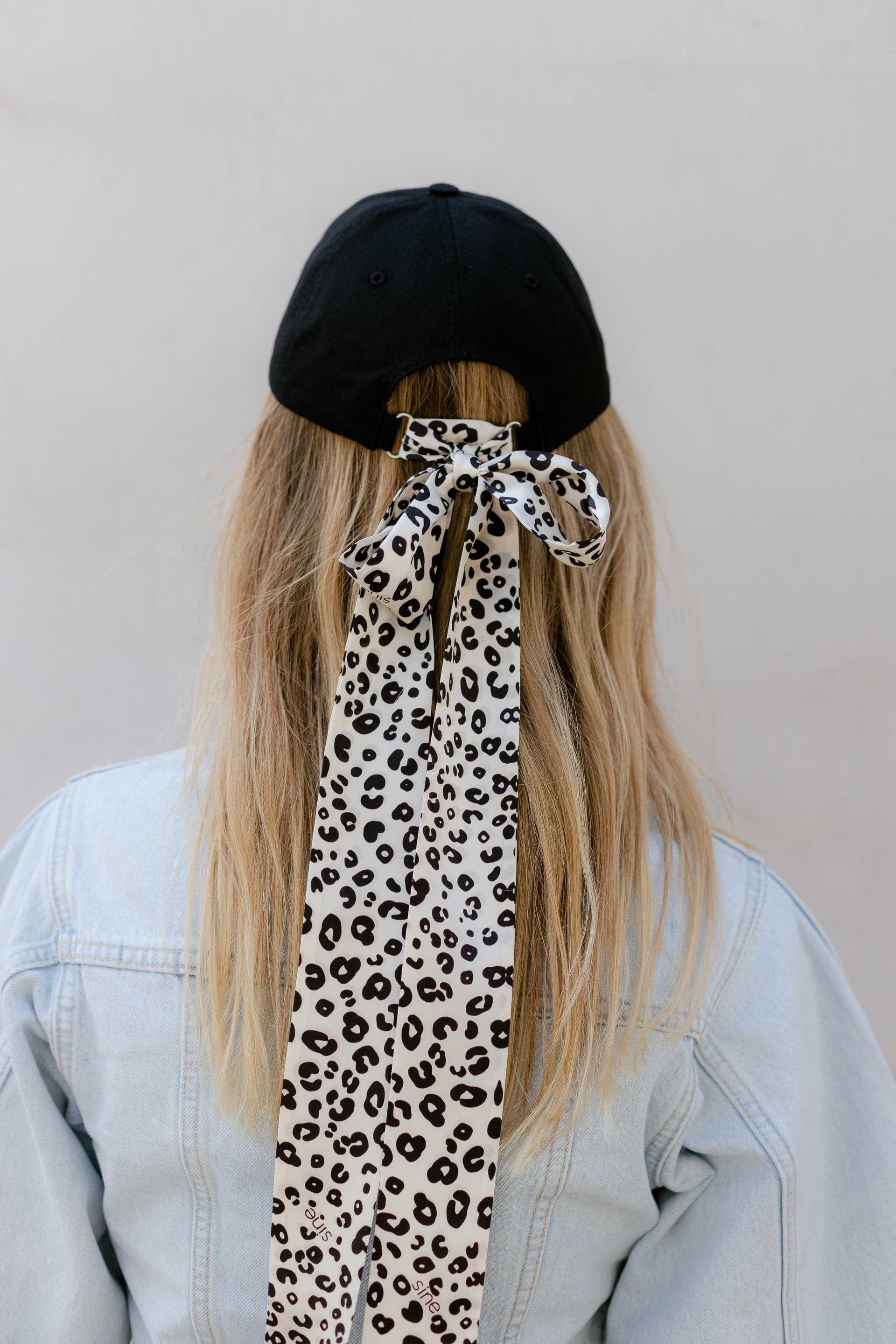 Black baseball cap with optional silk accessory
