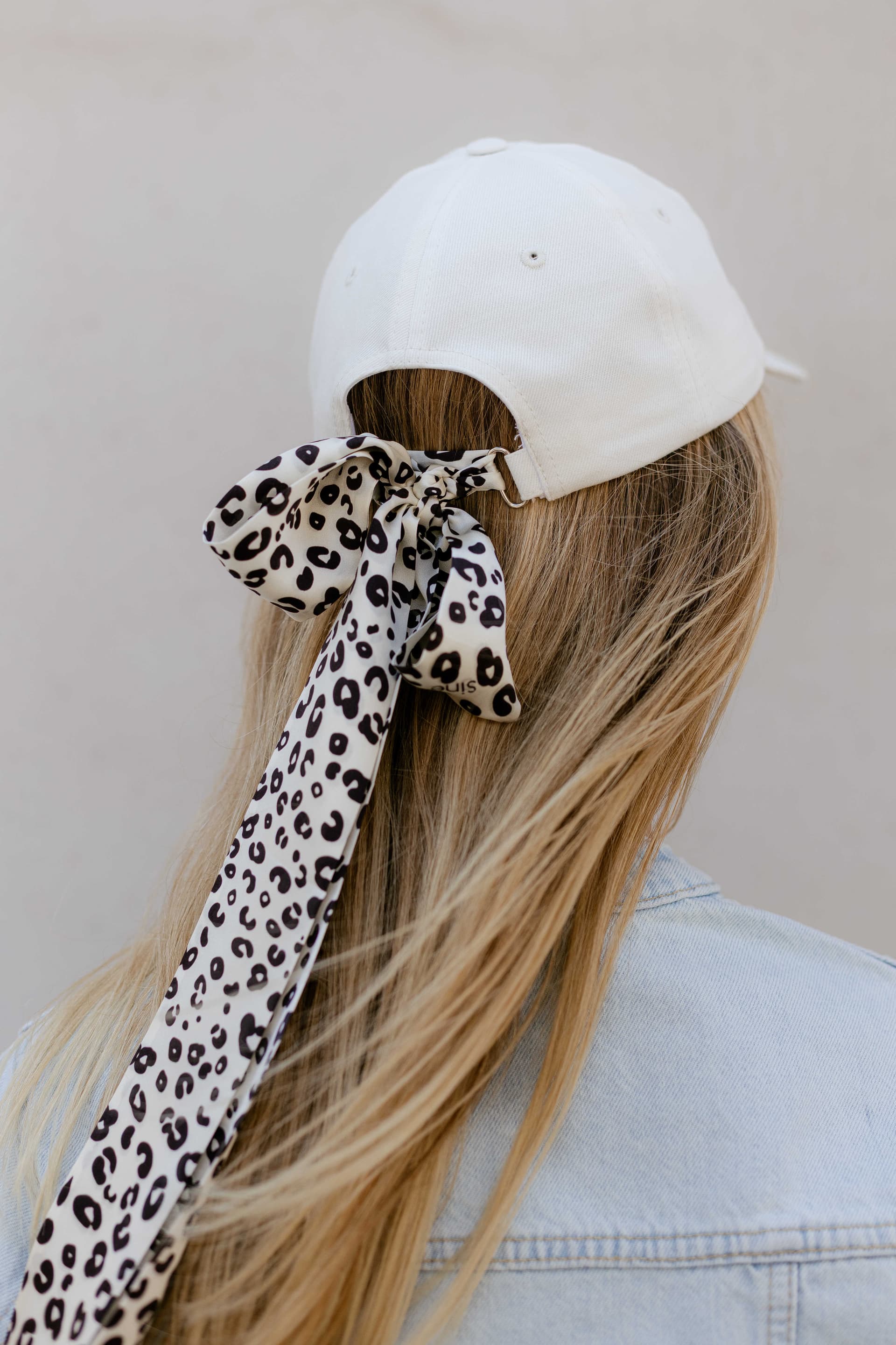 White baseball cap with optional silk accessory