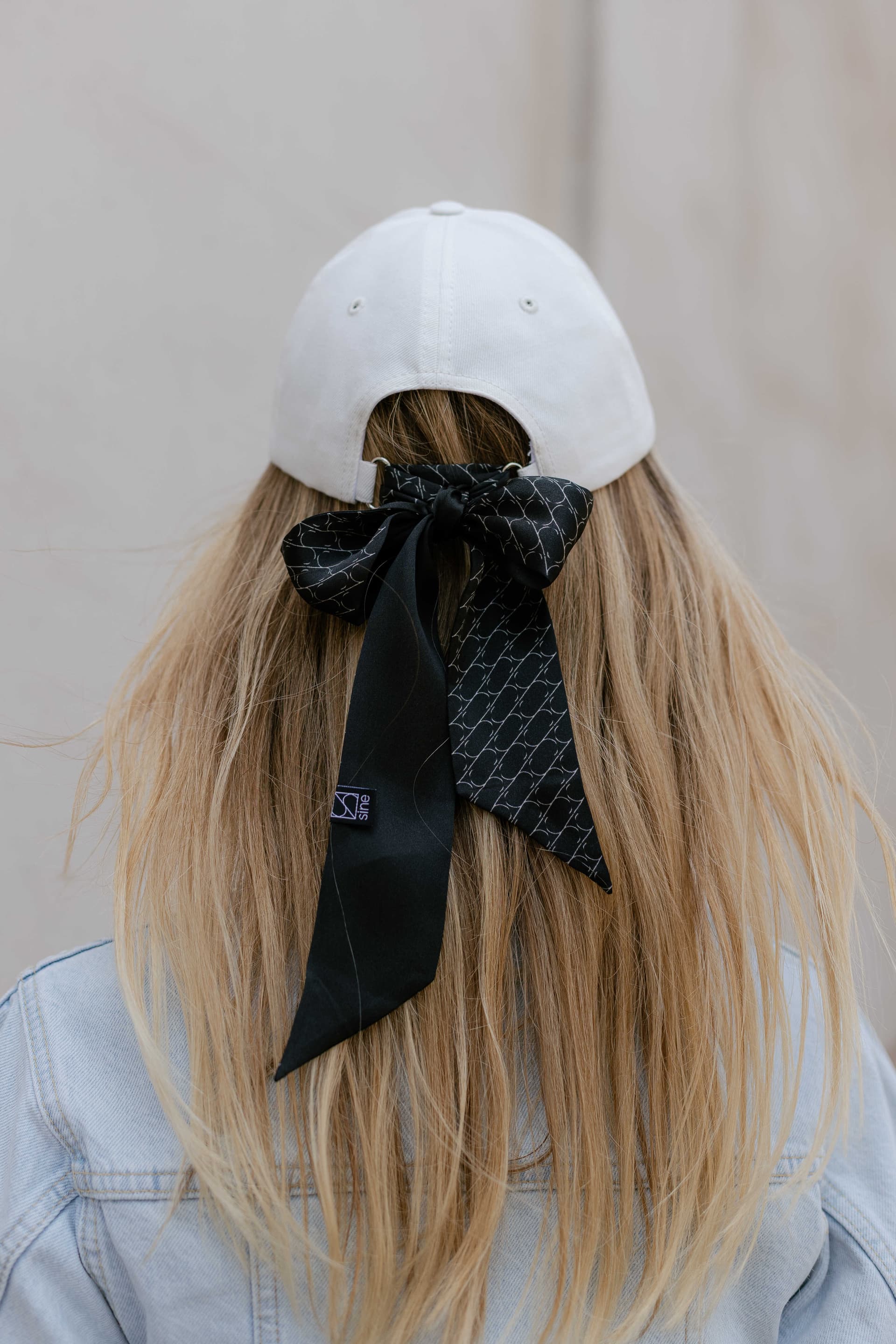 White baseball cap with optional silk accessory